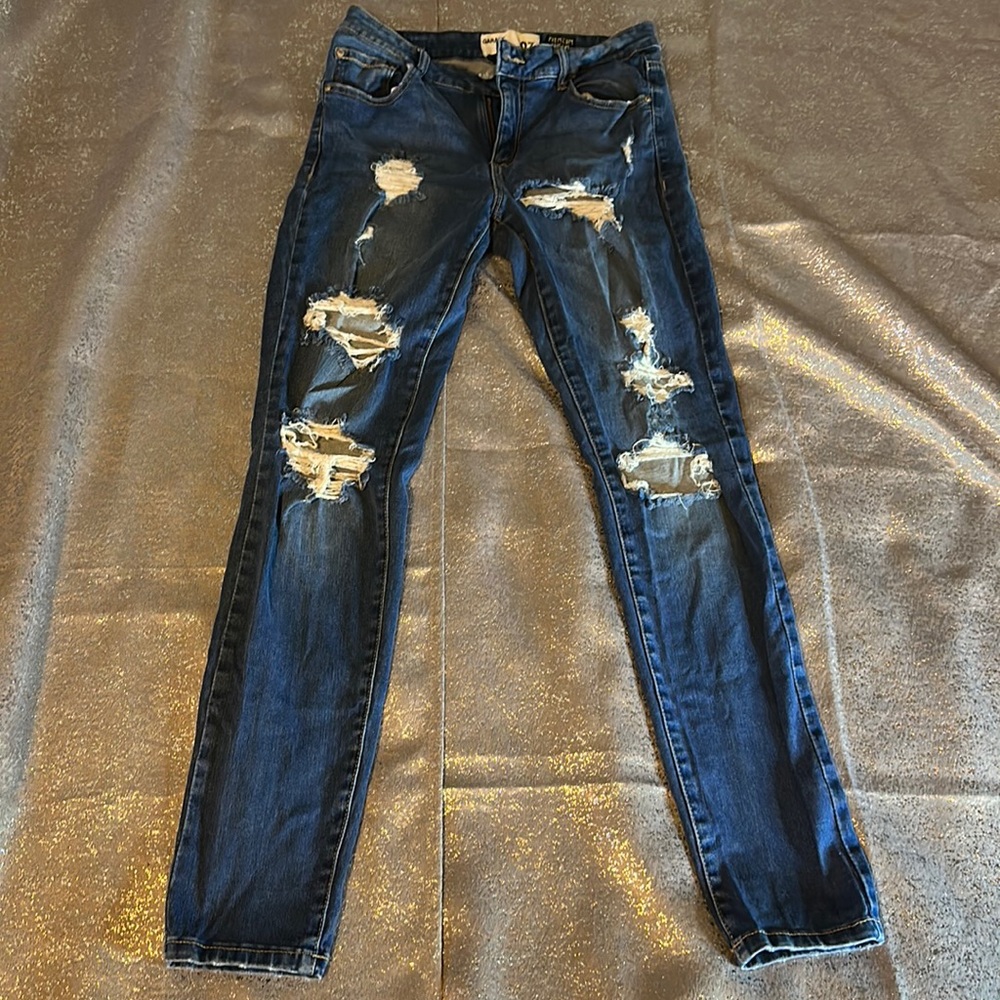 Garage Ripped up Dystressed Women’s jeans .. Size 07…premium denim super soft